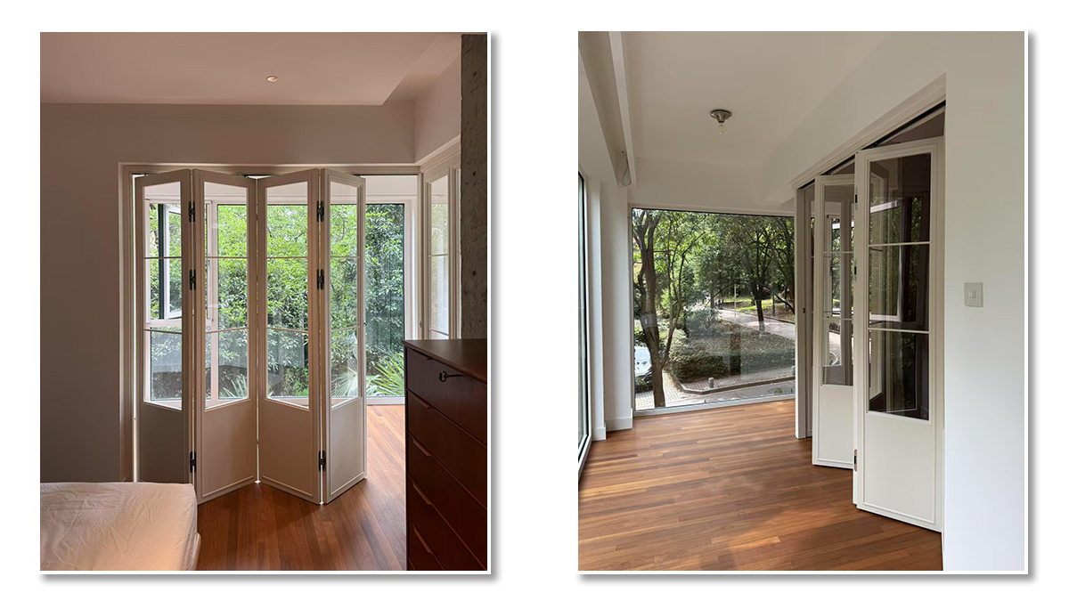 Modern glass aluminum folding doors fully opened to outdoor patio